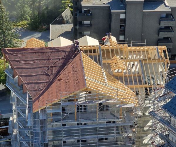 Travaux de charpente et toiture bois sur bâtiment collectif réalisés par Doxar France.